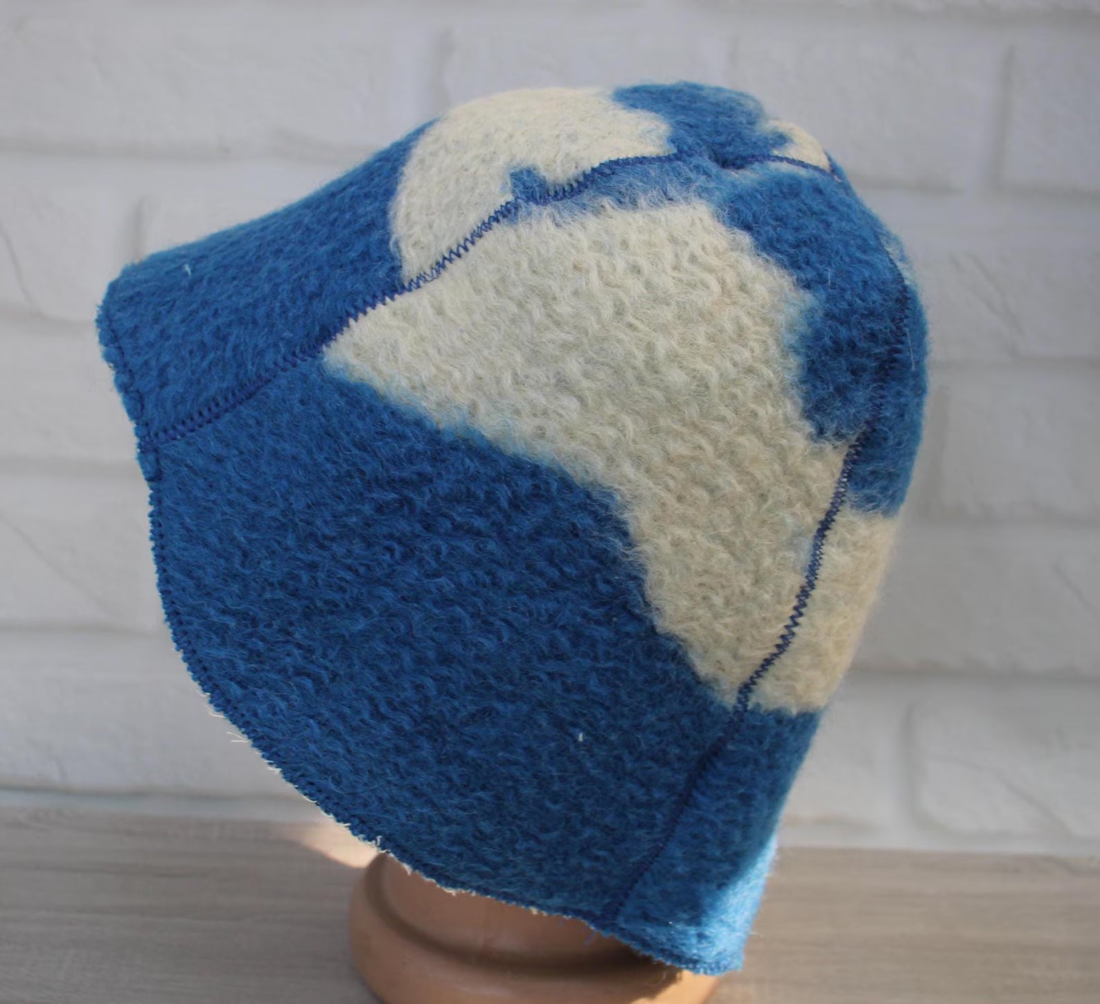 side view reversible upcycled wool sauna hat blue cream tones