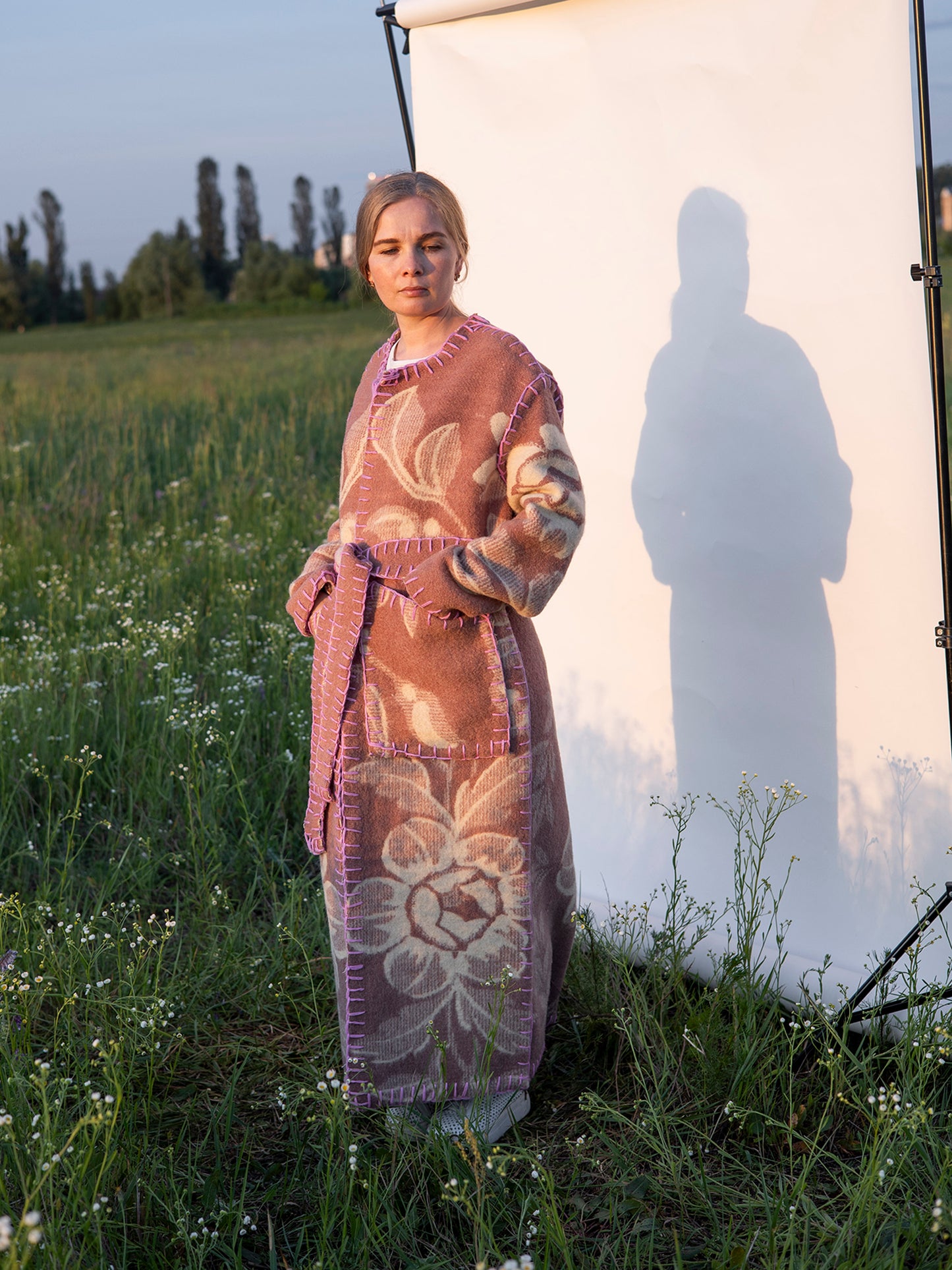 pocket side view with pink hand stitching vintage wool coat