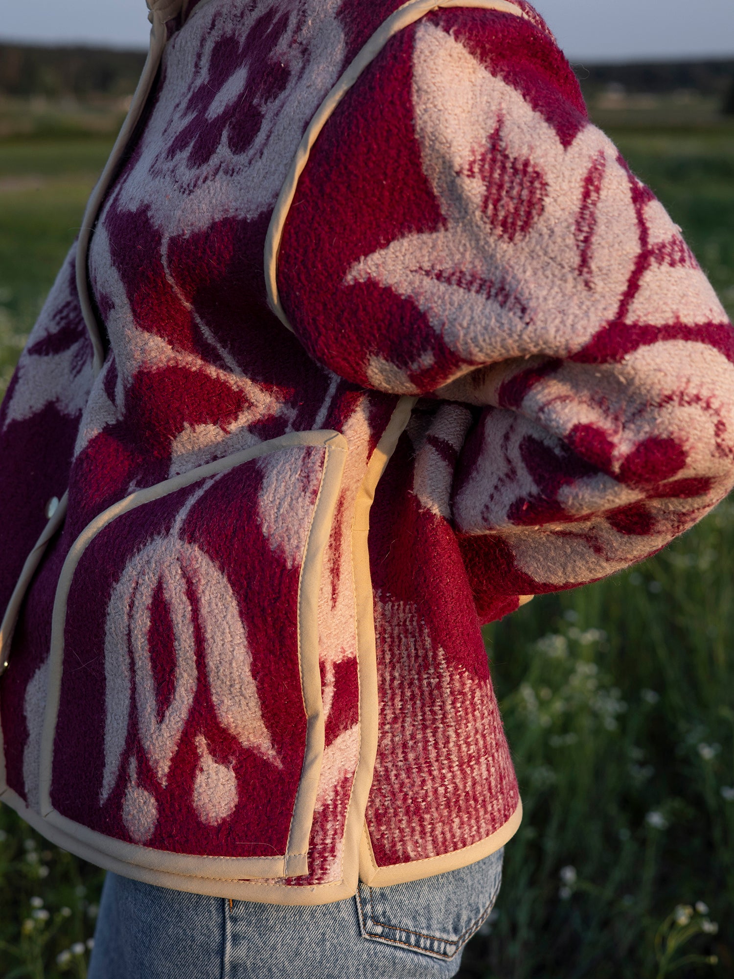 Close pocket detail on upcycled blanket jacket