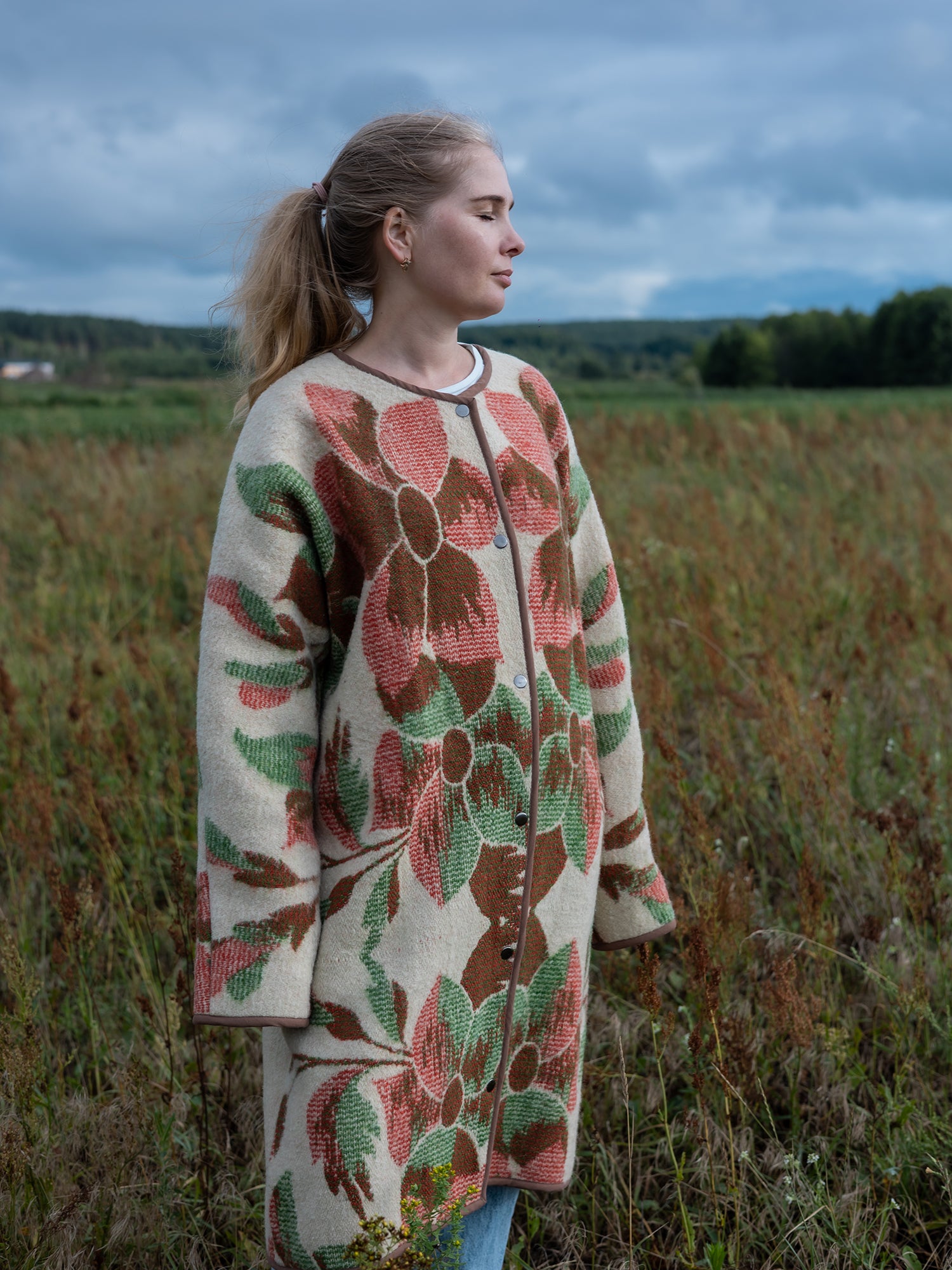  close-up floral tapestry pattern rust and green on cream wool