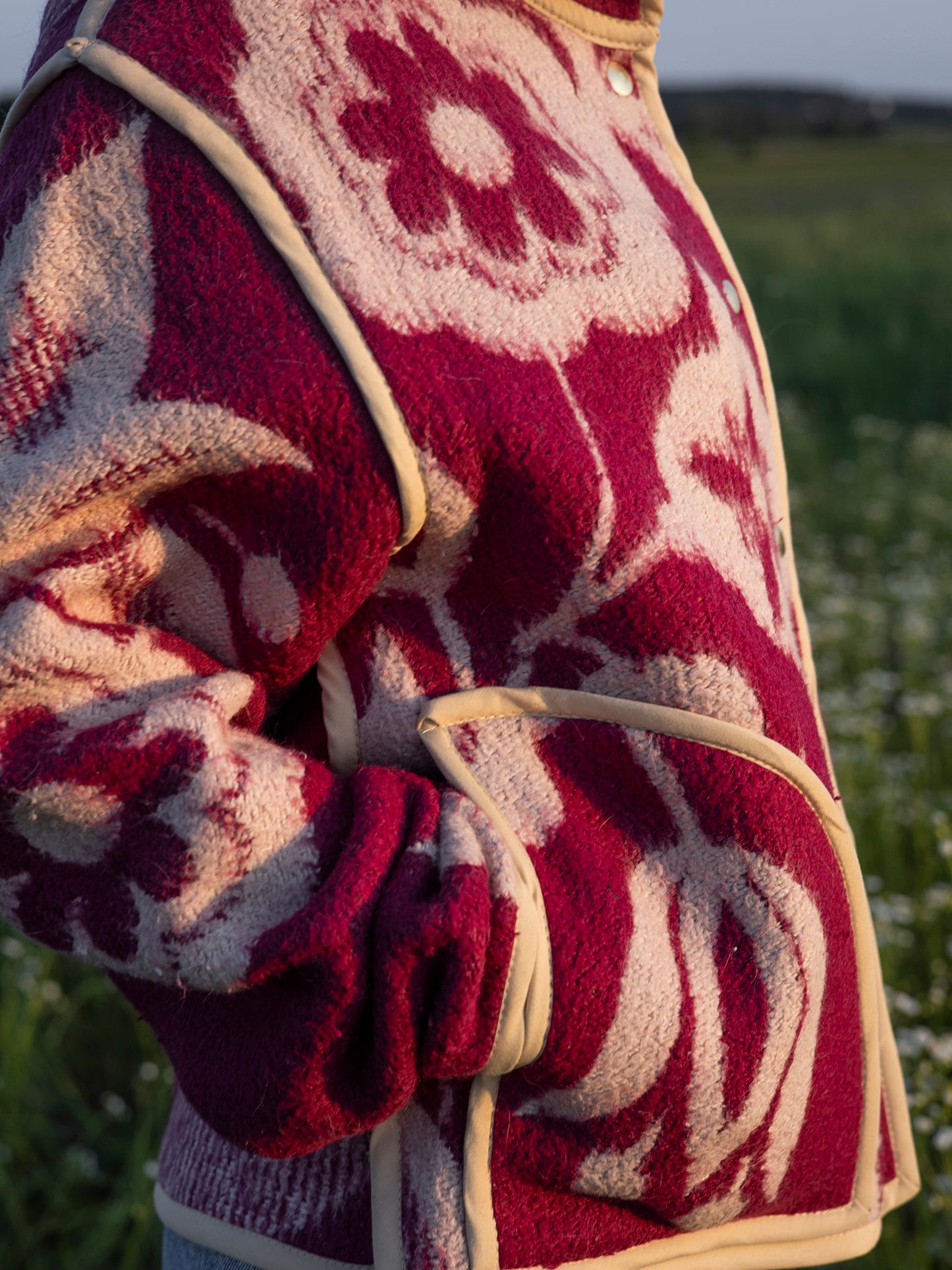 close-up beige trim detail on upcycled wool blanket jacket