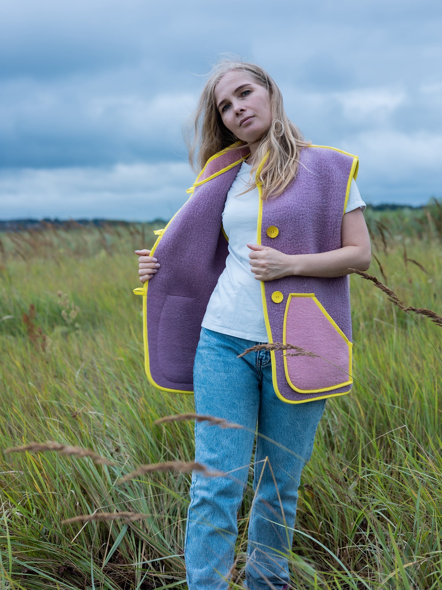 layering look upcycled wool vest over knit sweater